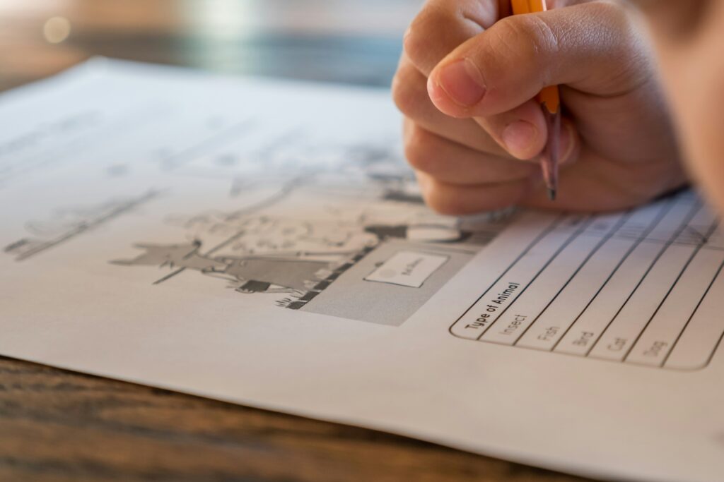 page with quiz questions on it being completed by person with pencil