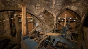 Interior of church tower with swfit boxes attached to the walls