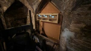 Wooden structure with holes for swifts